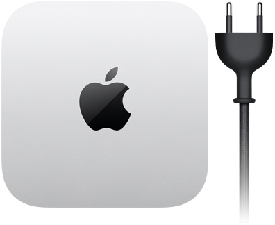 Mac mini, изглед отгоре, алуминий в сребърно, квадратна форма със заоблени ъгли, лъскаво черно лого на Apple в центъра, черен захранващ кабел с щепсел с два щифта.