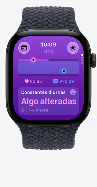 Apple Watch Series 12, caja de aluminio, color negro, app Constantes Vitales, resumen de salud, pulsaciones por minuto actuales, la lectura diurna de las constantes vitales indica valores algo alterados, correa Solo Loop trenzada, color azul marino