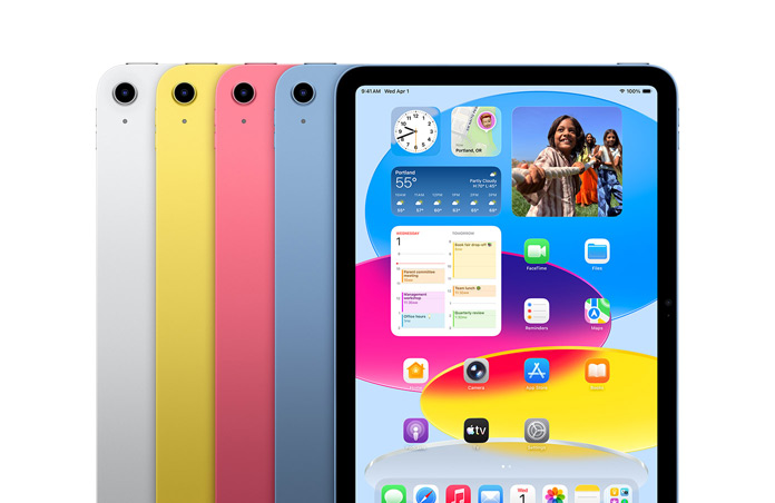 Dispositivos iPad dispostos em quatro cores: prateado, amarelo, rosa e azul, com o ecrã a mostrar um papel de parede e uma variedade de apps