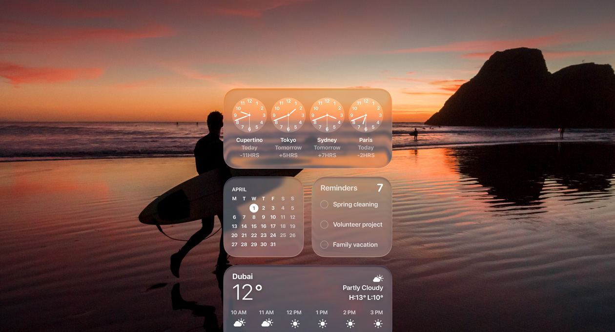 Liquid Glass Clock, Calendar, Reminders, and Weather widgets on macOS Tahoe screen over a scene of a surfer walking on the beach at sunset