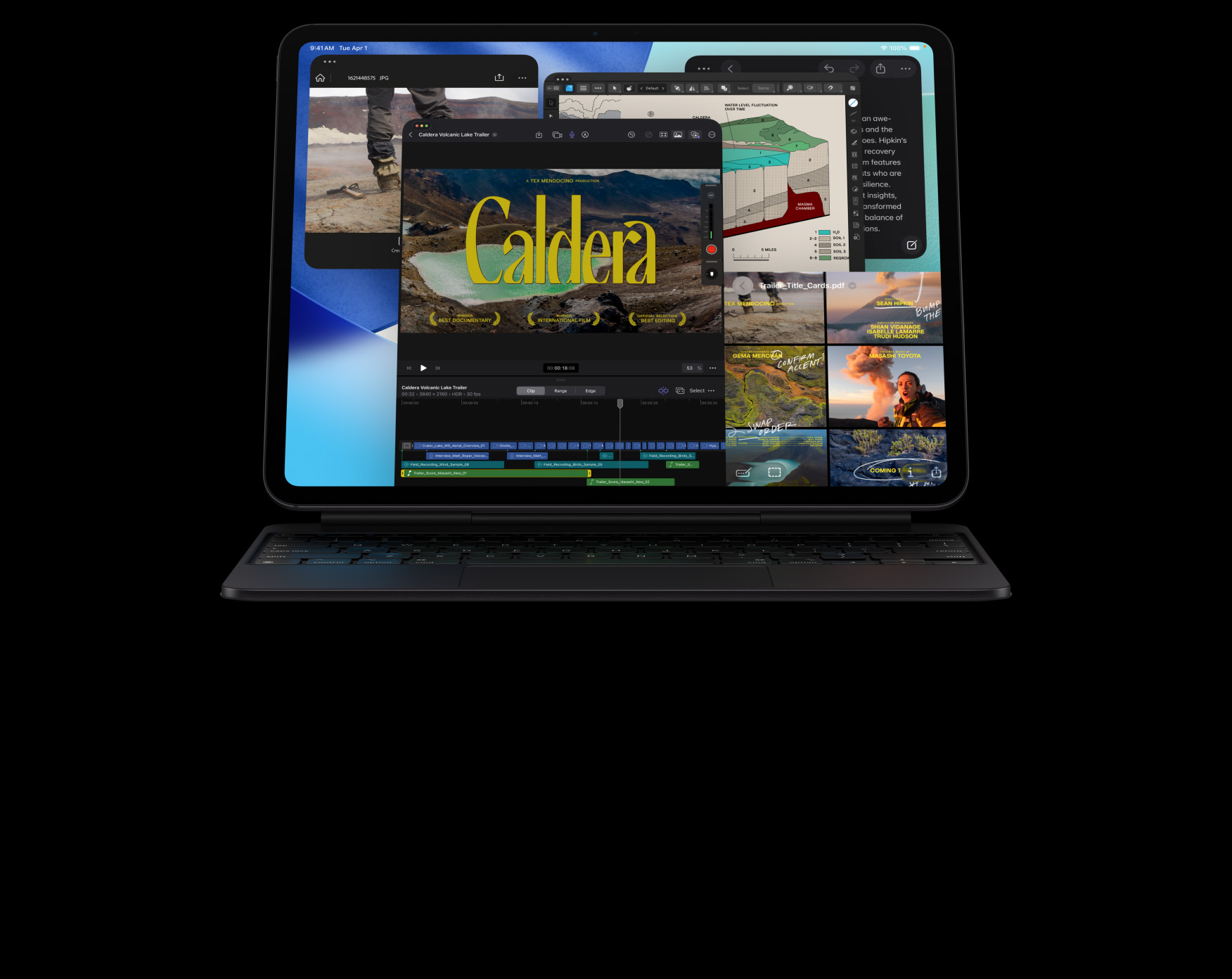 Widoczny od przodu iPad Pro  kolor gwiezdnej czerni, w układzie poziomym, podłączony do klawiatury Magic Keyboard w kolorze gwiezdnej czerni, na ekranie widać wiele okien aplikacji, w tym Final Cut Pro z funkcjami edycji wideo i osią czasu, Mapy, Notatki i materiały multimedialne