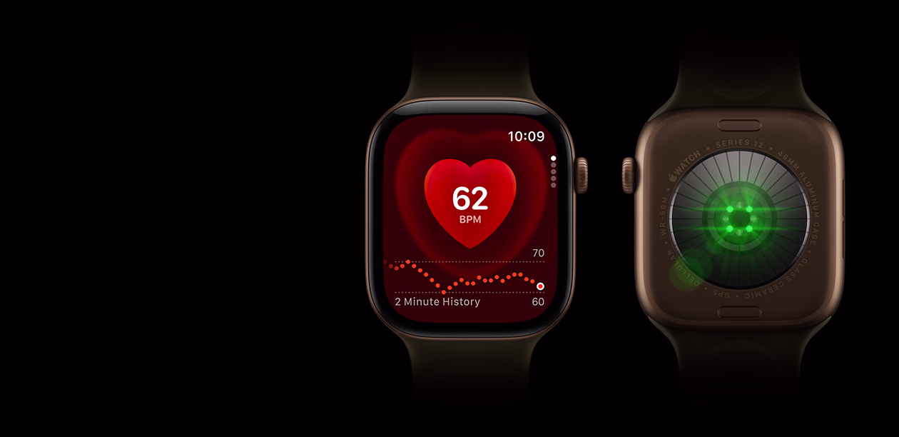 Two Apple Watch Series 12 devices, aluminum case, dark bronze color with olive Sport Band, one with Heart Rate app, the other showing the Health Sensing System on the back of the watch, with glowing green LED lights