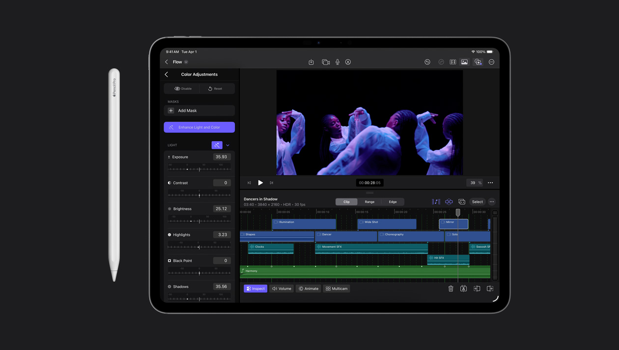 iPad Pro 13 screen showing color adjustment panel on the left, woman dancing in moody lighting on the right, video clip timeline at the bottom, Apple Pencil to the left of the device