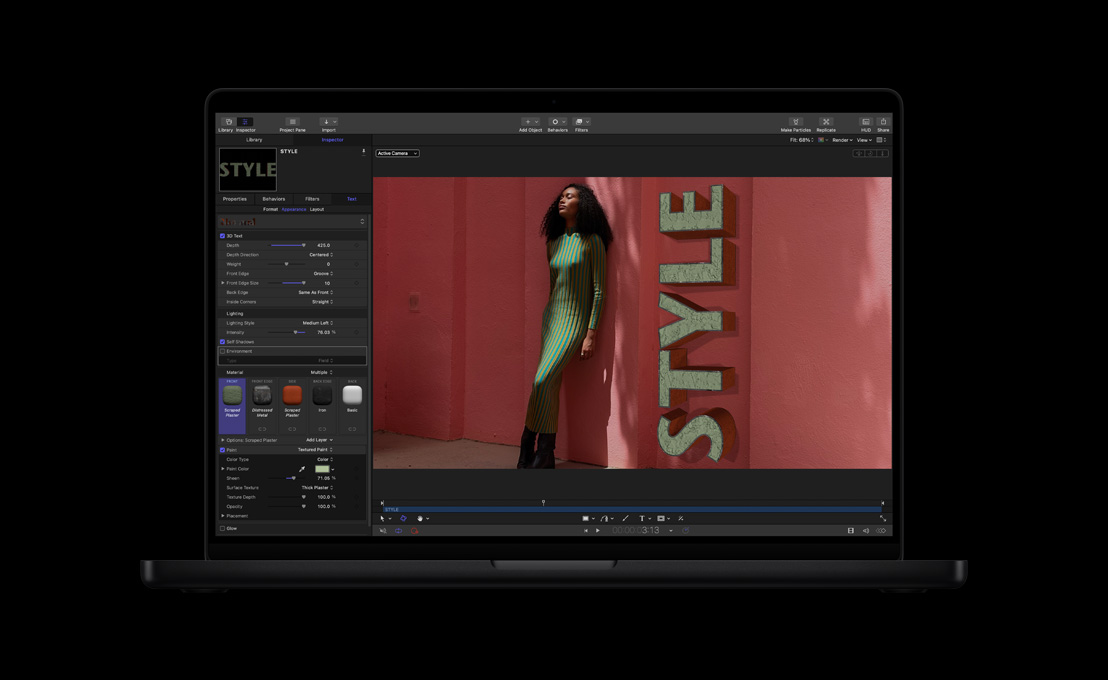 MacBook Pro 16, woman in green and yellow striped dress against red backgound, demonstration of 3D titles