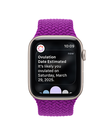 Apple Watch SE 3, screen shows estimated ovulation date, aluminum case, starlight color, Braided Solo Loop band, magenta color