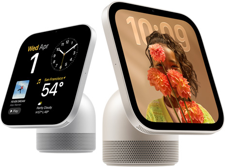 Apple HomeView, two devices: silver color, first screen shows date, clock, and weather, starlight color (pale gold), second screen shows time over a wallpaper of a person holding flowers