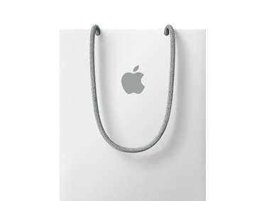 An Apple Store shopping bag, white color, with gray Apple logo and gray handles