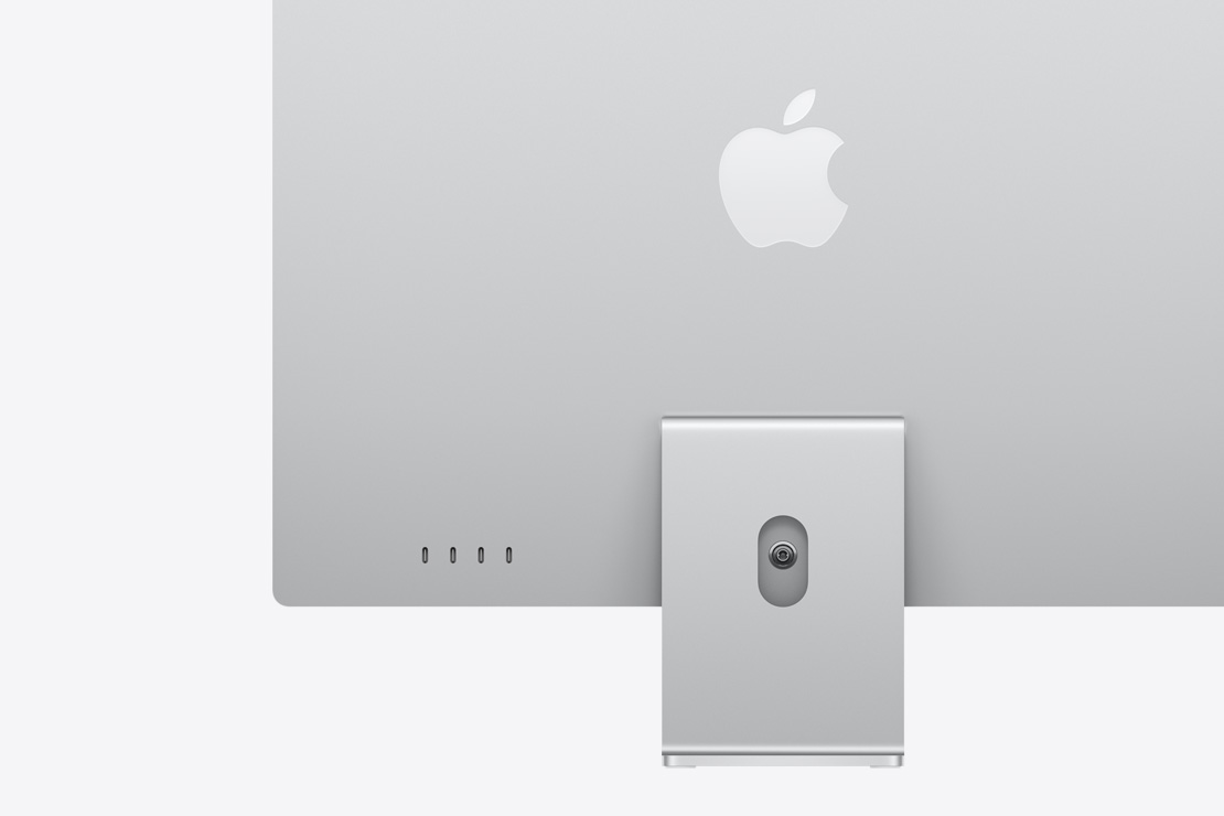 Hõbedane iMac tagantvaates, mis toob esile neli USB‑C liidest